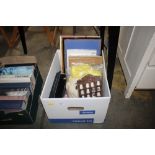 A box containing picture frames; a collection of t