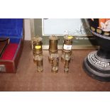 Six miniature brass miners lamps