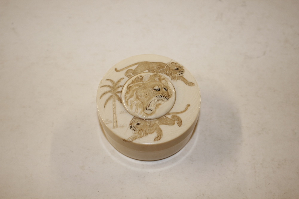 A Chinese ivory circular box decorated with tigers