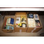 Three boxes of mostly paperback books