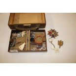 A jewellery box and contents of various brooches a