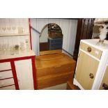 An Art Deco light oak dressing table with bevelled