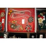 Various costume necklaces, pendants etc.