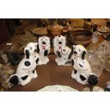 Two pairs of Staffordshire spaniel ornaments