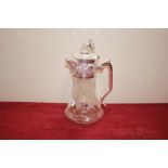 A glass and silver plate mounted claret jug, havin