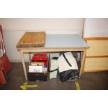 A Formica topped table; two chopping boards; a set