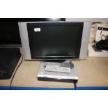 A UMC flat screen television and remote control; a