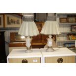 A pair of onyx table lamps with fabric shades