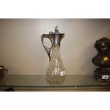 An etched glass Art Nouveau claret jug with plated