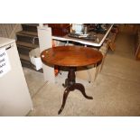 An oval mahogany occasional table on tripod base