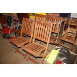 Four folding teak garden chairs