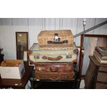 A wicker picnic hamper; and three vintage suitcase