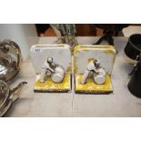 A pair of decorative "Golden Spirit" plaster bookend