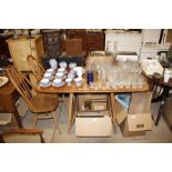 An Ercol drop leaf kitchen table; and a pair of st