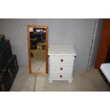 A painted pine three drawer bedside chest; and a p