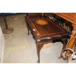 A reproduction mahogany inlaid coffee table