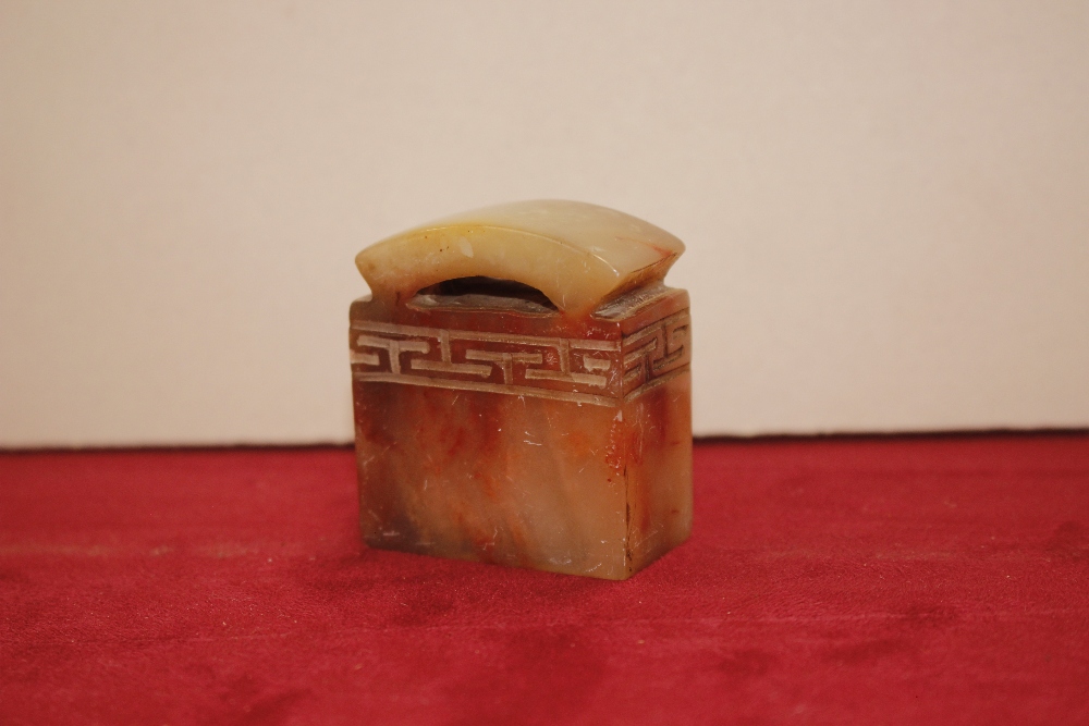 An oriental carved soapstone seal