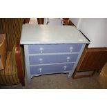 A blue painted chest of three drawers