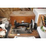 A vintage Frister & Rossman sewing machine in inla