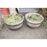 A pair of wooden and metal bound planters