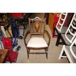 An Edwardian inlaid mahogany salon elbow chair