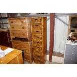 A modern pine and wicker nine drawer chest