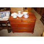 A mahogany effect chest of two short and two long