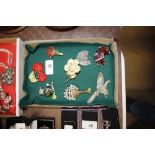 Various vintage brooches depicting cherries, eleph
