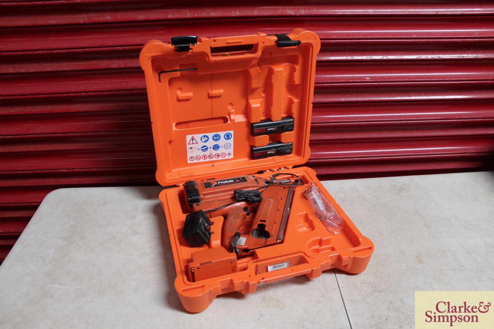 Paslode Impluse IM 350/90 CT nail gun with two batteries and charger in case.