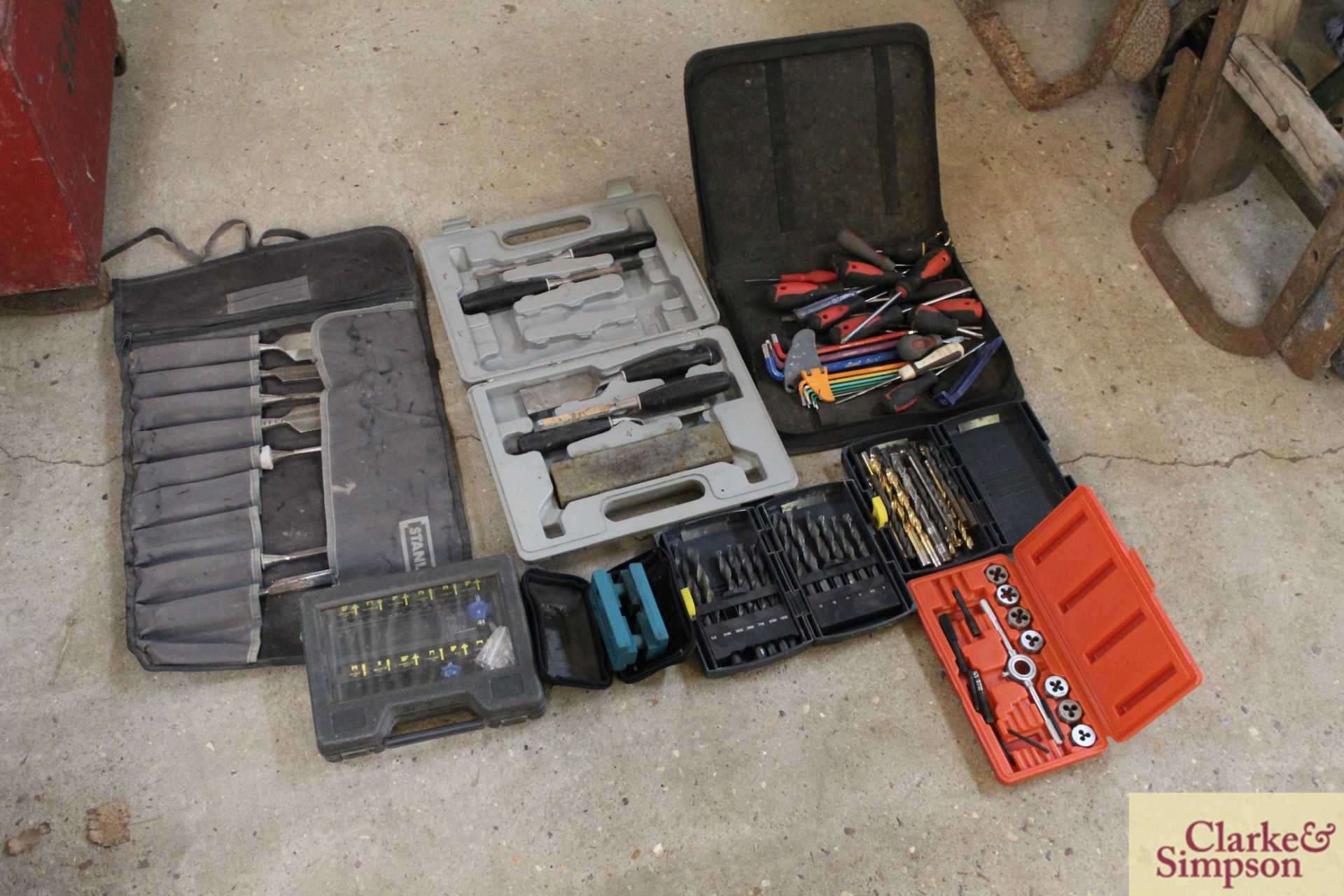 Box containing various drill bits, router bits, chisel set etc.