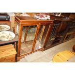 A yew wood effect display cabinet