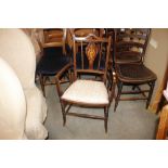 An Edwardian inlaid mahogany salon elbow chair