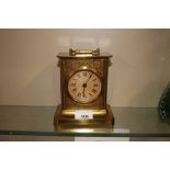 A brass cased carriage clock with spring driven mo