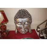 A silvered face wall Buddha decoration