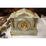 A Victorian green marble cased mantel clock with e