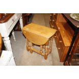 A light oak barley twist gate leg coffee table