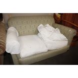 A two seater settee complete with cushions