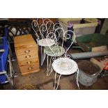 Three wrought metal garden chairs