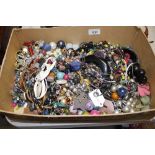 A box of assorted jewellery, beads etc.