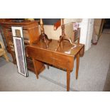 An antique elm drop leaf table