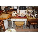 A mahogany and partly panted writing table with le