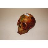 An amber coloured skull