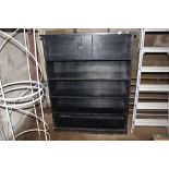 A black painted locker cabinet with open shelves
