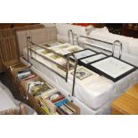 An electric adjustable bed with side rails and mat