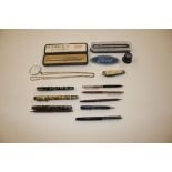 Various biros; a fountain pen; Union Jack penknife