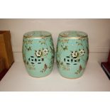 A pair of green pottery bird decorated barrel seat