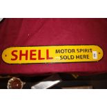 A cast metal Shell sign