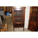 An oak leaded glazed corner cupboard with open she