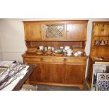 A large continental walnut kitchen dresser