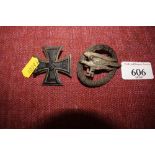 A German iron cross brooch and a German cap badge